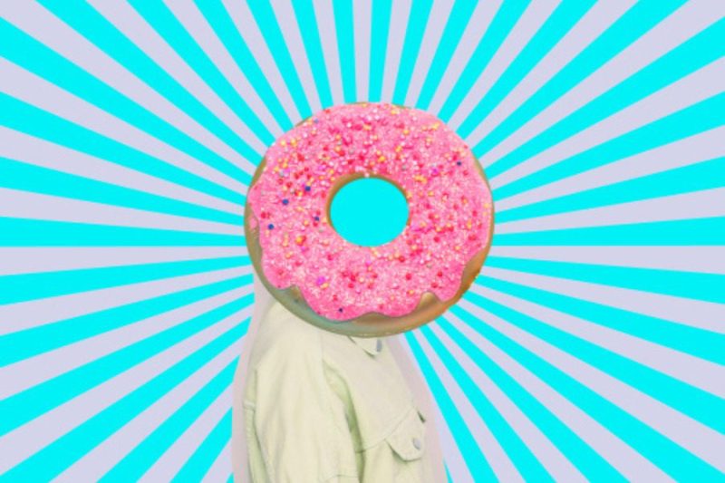 Modern art collage of a donut in place of a head over a human body with a hypnotic background