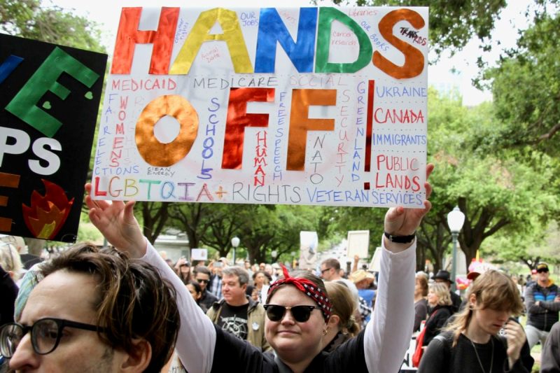 Person holding sign at Texas Capitol rally